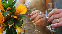 photograph of wedding rings and wedding flowers