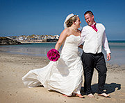 Lucy and Ross photographed after their wedding ceremony on Porthminster beach, St Ives