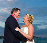 Louise and Chris photographed on Porthminster, beach St Ives after their wedding breakfast
