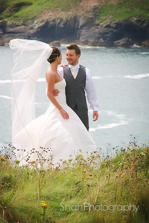 Cornish sea view with bride and groom at Mullion
