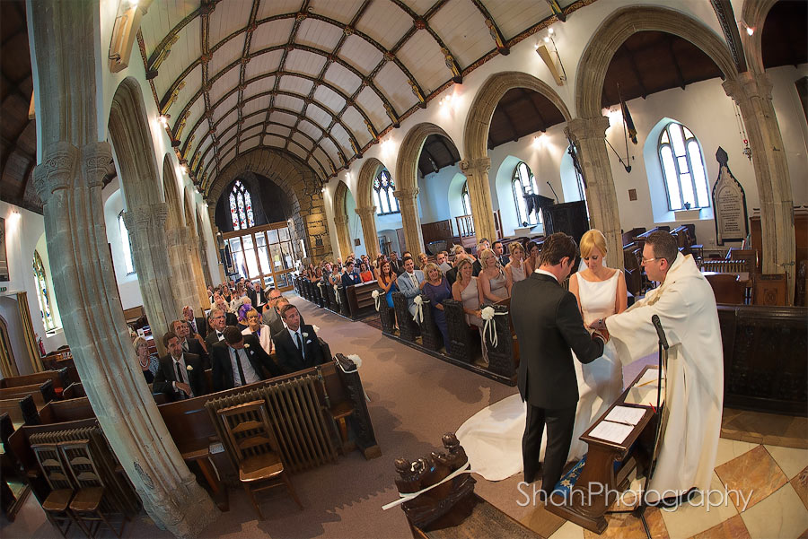 just after their vows the bride and groom about to be blessed