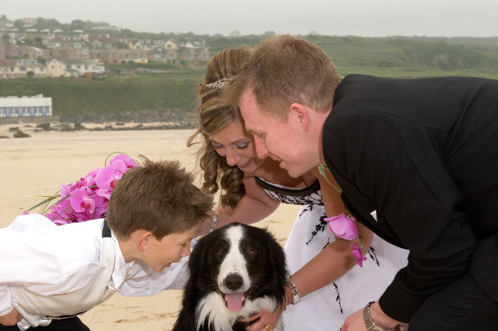 Wedding day family photo on Porthmeor beach St Ives