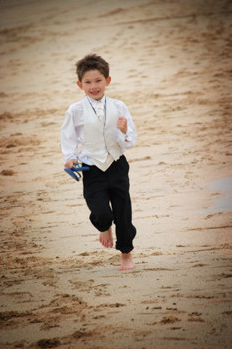 Page boy Ethan enjoys Porthmeor beach St Ives