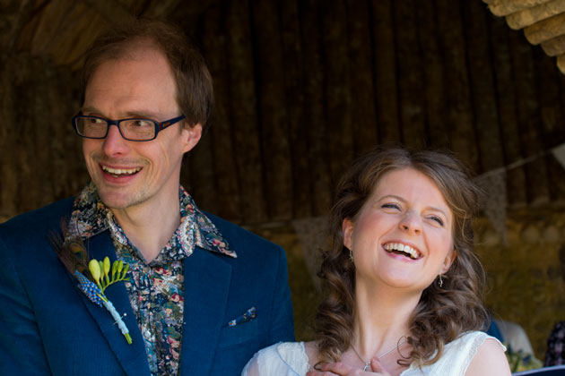 photojounalistic wedding photograph bride and groom during their outdoor wedding ceremony in Cornwall