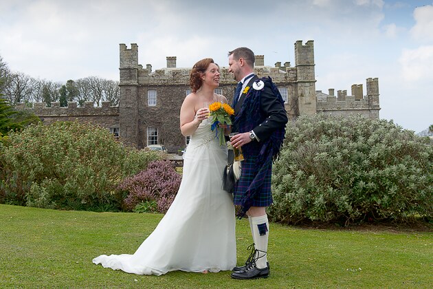 photojournalistic wedding photograph bride and groom in the grounds of the wedding venue 