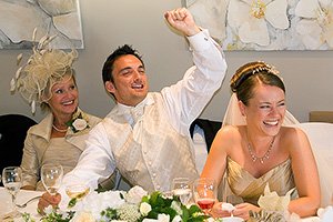 bride and groom photographed during the speeches at their wedding reception