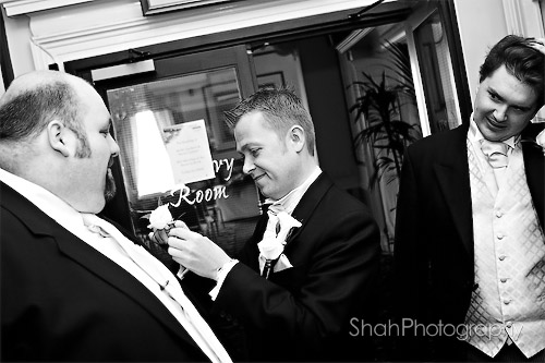 the all important button hole flowers for the groom, best man and ushers before the ceremony