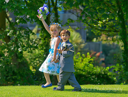 page boy and bridesmaid got bored with the photography