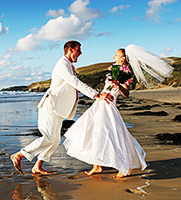 Tamsyn and Matt having fun on the beach