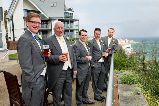 The groom, groom's father and friends