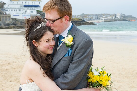 Bride and groom have a cuddle