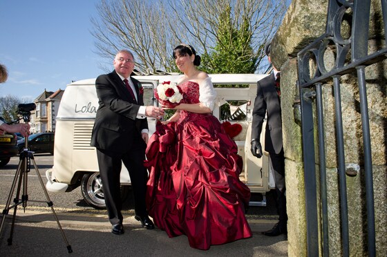 The bride arrives at the church  with her father 