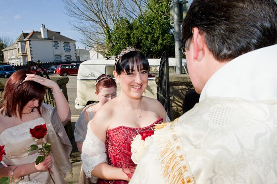 Radiant smile from the bride as she gets ready for her grand entrance to the church in Camborne