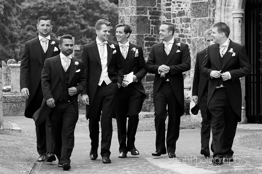 The groom's men arriving with the groom in their morning suits before the church wedding ceremony