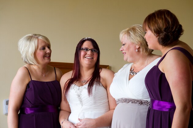 bride photographed with her bridesmaids by wedding photographer Pervaiz Shah