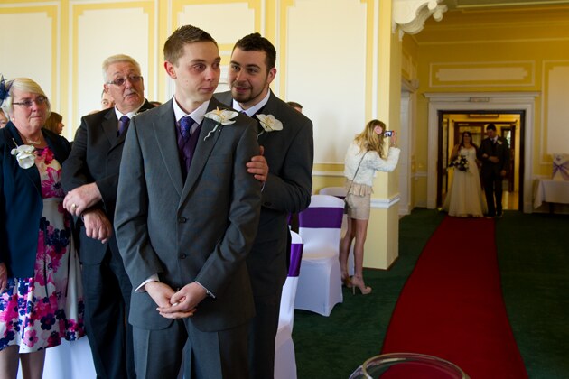 emotional groom as the bride makes her entrance