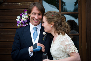 photojornalistic photo of bride and groom enjoy the speeches