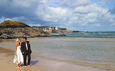 Abi and Mike photographed on Porthminster beach during their wedding day