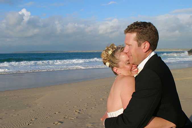 wedding photograph shows Porthminster Beach St Ives taken by Pervaiz Shah of Shah Photography