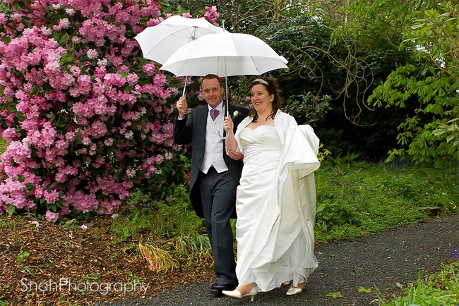 Nicky and Phil photographed amongst flower petals