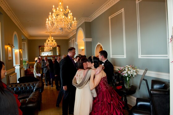 wedding guests being greeted by the bridal party before the wedding breakfast in the Sands restaurant